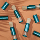 Colore science brush on powder spf products on a brown background