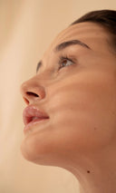 Close-up of a woman's face with a neutral background