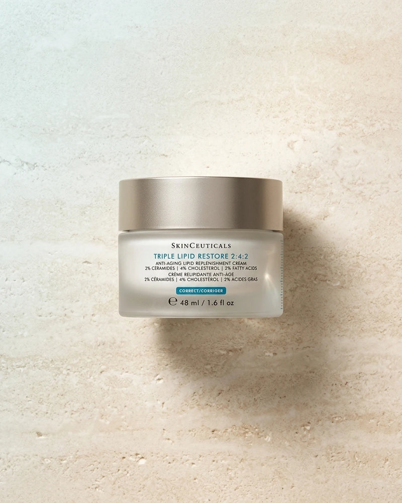 Skinceuticals Triple Lipid Restore 2-4-2 jar on a textured beige background
