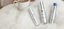 Alastin, Vivier and ZO Skincareproducts on a fluffy white surface with a cup of coffee.